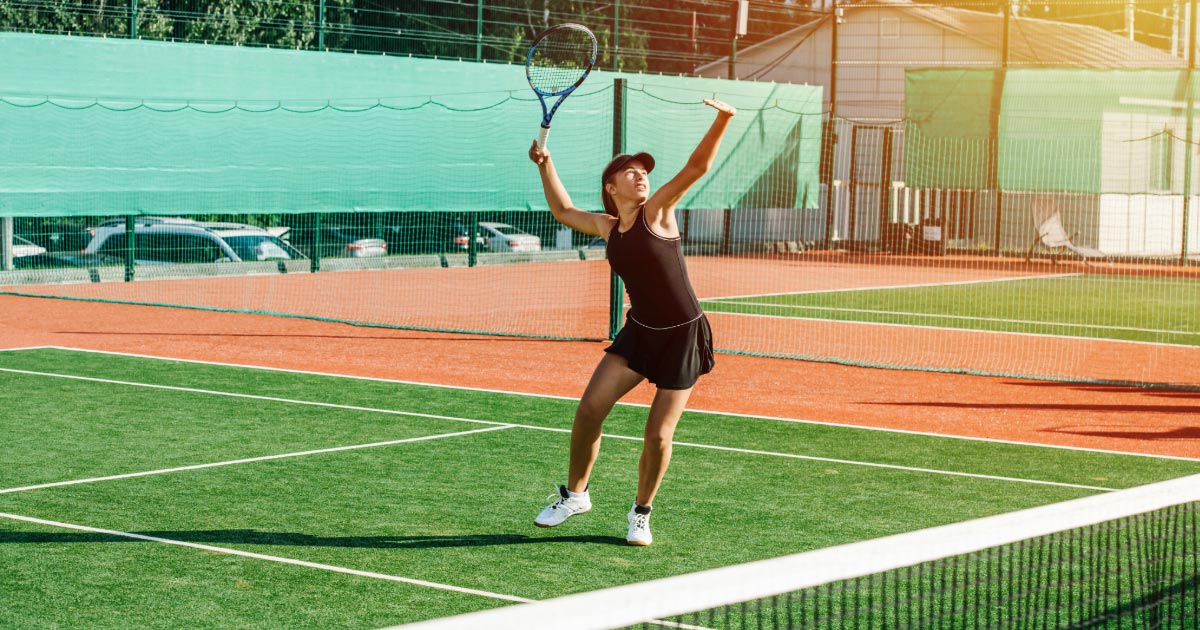 Young tennis player hitting a volley shot during practice